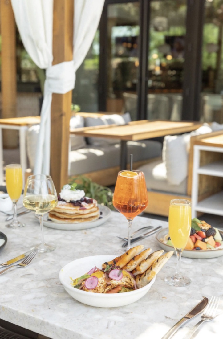 Brunch spread with mimosas on the patio at Cala Scottsdale